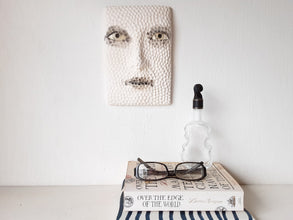 Black and white sculptural wall art face, textured 3D female with hand carved pattern,  minimalist decor for Scandi interior