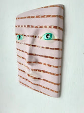 Pink and brown striped wall mask, ceramic sculpture of face