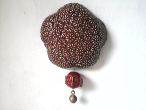 Deep berry red ceramic wall sculpture with happy Buddha head and brass temple bell, Buddhist art gift