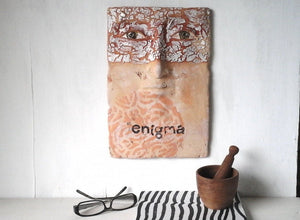 Wall sculpture of human face, ceramic art mask, rustic bedroom decor, enigma artwork from Louise Fulton Studio