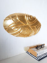 Gold ceramic wall sculpture carved into oval shape, Modernist luxe gilt wall decor