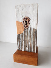 Modern sculpture head on timber plinth, ceramic female face in terracotta with black and white stripes