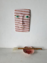 Pink and brown striped wall mask, ceramic sculpture of face