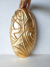 Gold ceramic wall sculpture carved into oval shape, Modernist luxe gilt wall decor