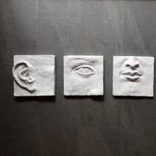 Large white art triptych, ceramic classic sculpture of face in three parts, hear no see no speak no evil