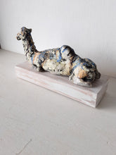 Desert camel with sandy colours, ceramic sculpture on timber mount, Sahara nomad art