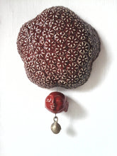 Deep berry red ceramic wall sculpture with happy Buddha head and brass temple bell, Buddhist art gift