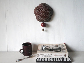 Deep berry red ceramic wall sculpture with happy Buddha head and brass temple bell, Buddhist art gift