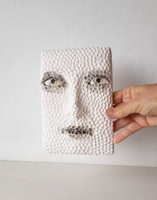 Black and white sculptural wall art face, textured 3D female with hand carved pattern,  minimalist decor for Scandi interior