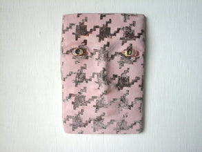 Pink and brown houndstooth sculpture of face, mid-century modern art mask