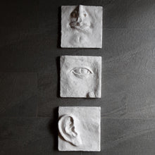 Large white art triptych, ceramic classic sculpture of face in three parts, hear no see no speak no evil