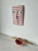 Pink and brown striped wall mask, ceramic sculpture of face