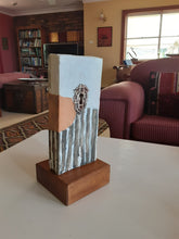 Modern sculpture head on timber plinth, ceramic female face in terracotta with black and white stripes