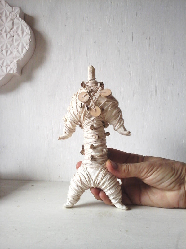 Mummy sculpture wrapped in string and handmade beads, ceramic fetish doll, tribal decor