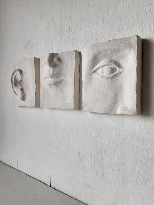 White wall art triptych, handmade ceramic classic sculpture of face in three parts, hear no see no speak no evil