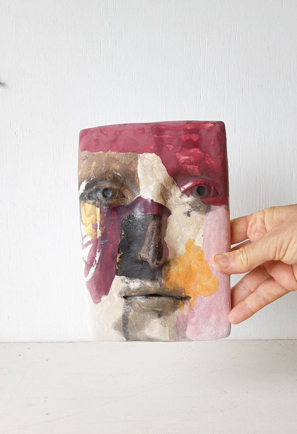 Pink and gray ceramic abstract face, colorful modernist style 3D sculpture wall mask