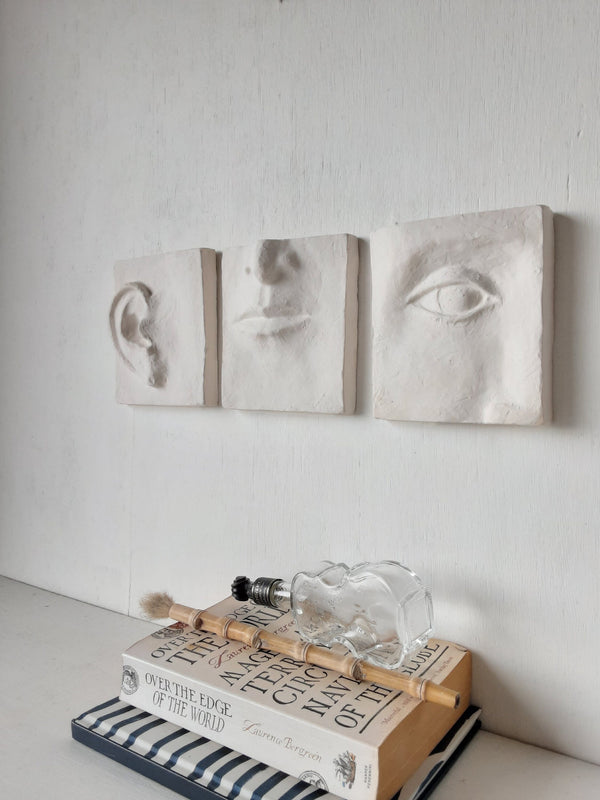 White wall art triptych, handmade ceramic classic sculpture of face in three parts, hear no see no speak no evil