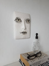 Black and white sculptural wall art face, textured 3D female with hand carved pattern,  minimalist decor for Scandi interior