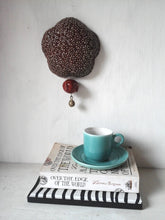 Deep berry red ceramic wall sculpture with happy Buddha head and brass temple bell, Buddhist art gift