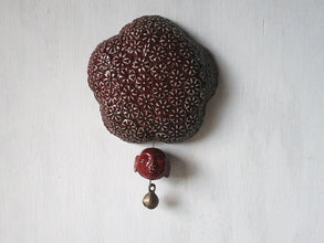 Deep berry red ceramic wall sculpture with happy Buddha head and brass temple bell, Buddhist art gift