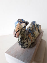 Desert camel with sandy colours, ceramic sculpture on timber mount, Sahara nomad art