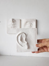 White wall art triptych, handmade ceramic classic sculpture of face in three parts, hear no see no speak no evil